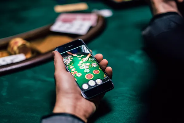 A glowing roulette wheel with cascading chips, symbolizing the engaging live and instant-win games available on T9999.